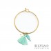 Bracciale bangle in acciaio color oro con ciondolo pesce e nappina