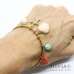Bracciale bangle in acciaio color oro con conchiglia stella marina turchese e perla