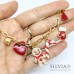 Bracciale catena acciaio dorata con omino pan di zenzero e charms natalizi