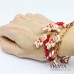 Bracciale catena acciaio dorata con omino pan di zenzero e charms natalizi