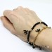 Bracciale elastico con ciondolo rondine nera e cristalli