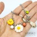 Bracciale primaverile catena acciaio con coniglio pulcino e margherita
