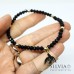 Bracciale elastico con ciondolo rondine nera e cristalli
