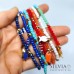 Bracciale elastico con corallini o cristalli colorati da 4mm e ciondolo