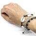 Bracciale elastico nero con conchiglie e charms in acciaio a tema mare