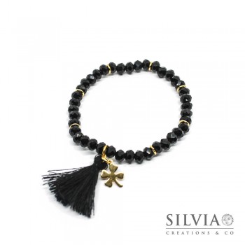 Bracciale elastico cristalli neri da 4x6 mm con nappina e quadrifoglio in acciaio color oro