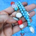 Bracciale con perle turchese corallo e conchiglia bianca