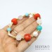 Bracciale elastico Sandra con perle turchese e corallo 
