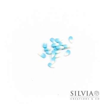 Fettine in pasta polimerica a forma di petalo azzurro 5x3 mm x 100pz
