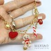 Collana girocollo catena acciaio dorata con omino pan di zenzero e charms natalizi