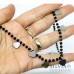 Collana girocollo catena acciaio con cristalli neri e sette cuoricini