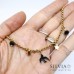 Collana girocollo con ciondolo rondine nera stelle e cristalli