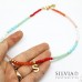 Collana girocollo corallini o cristallini colorati con ciondolo