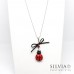 Collana lunga con fiocco e coccinella rossa