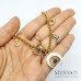 Collana girocollo talismano oro in acciaio con luna rovesciata e charms