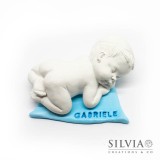 Gesso a forma di bambino che dorme su copertina