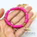 Bracciale elastico con perline heishi fucsia e stella marina oro