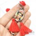 Orecchini pendenti ispirati a Frida Kahlo con rose e nappine