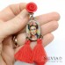 Orecchini pendenti ispirati a Frida Kahlo con rose e nappine
