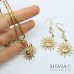 Collana catena effetto corda in acciaio dorato con ciondolo sole
