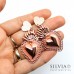 Orecchini perno con cuore satinato in acciaio e sacro cuore ex voto color oro rosato