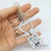 Portachiavi con scritta "Best Dad in the world" e charms